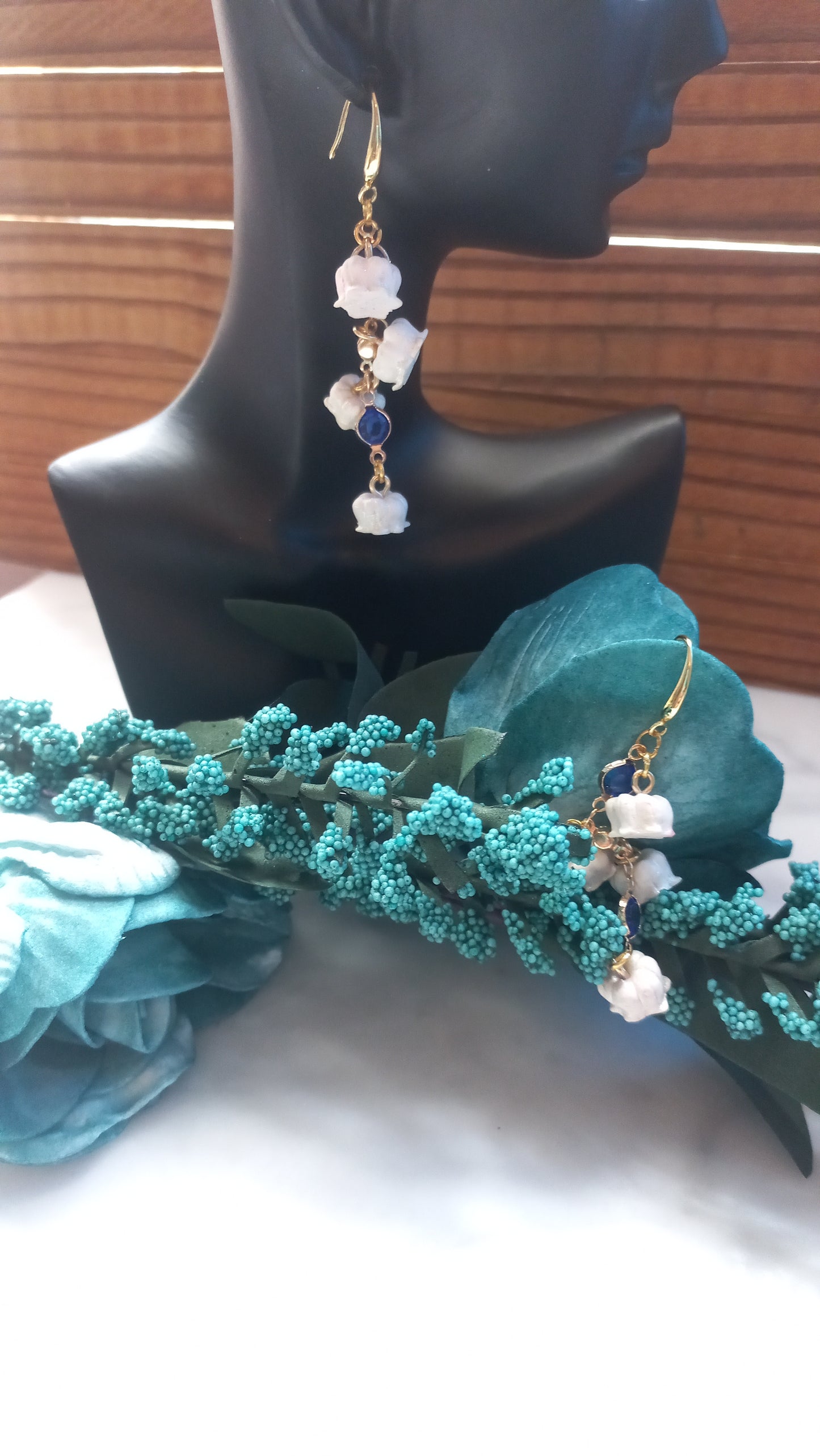 Polymer clay lily flowers with blue gemstones