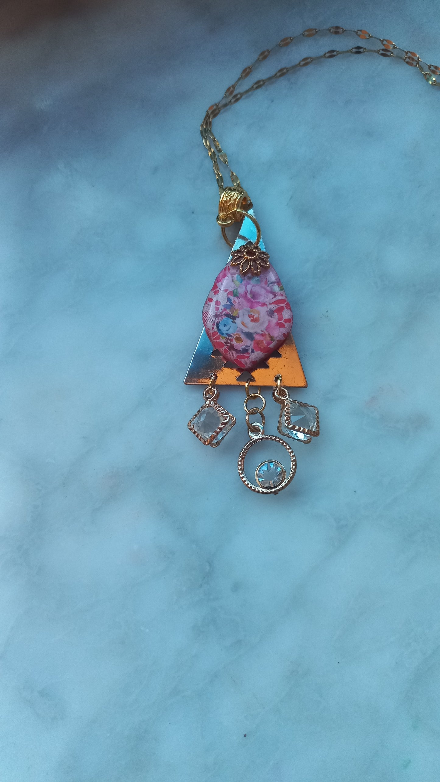 Polymer clay lace silkscreen floral pendant with gold plated chain.