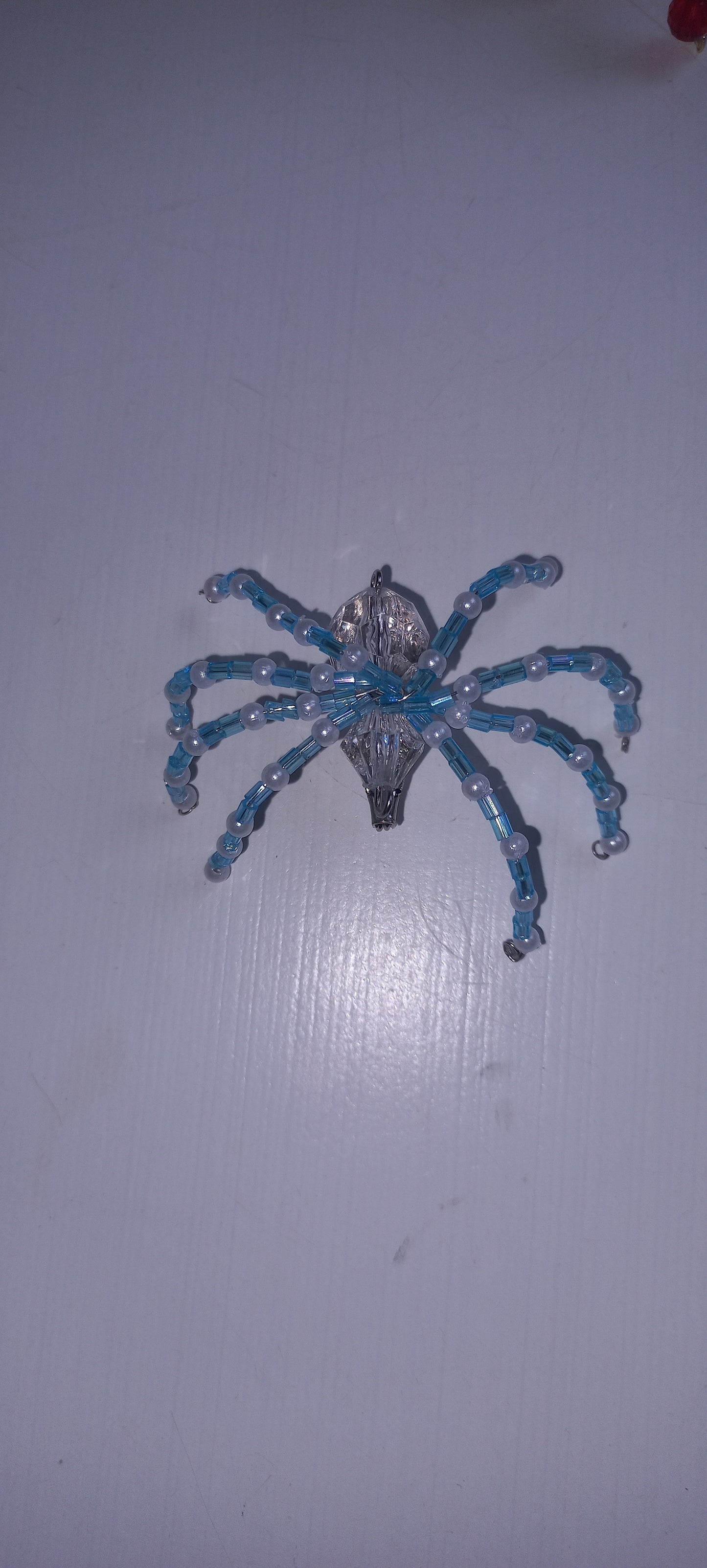 Beaded spider brooches