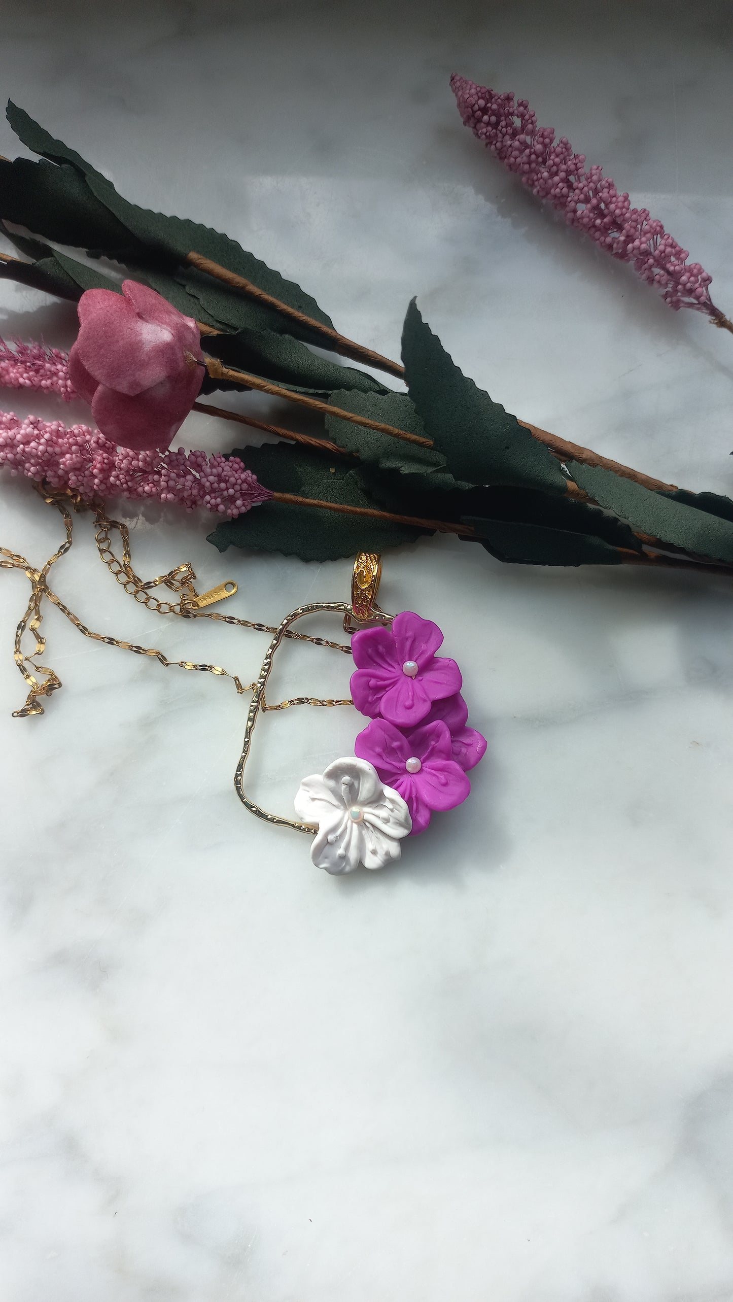 Purple & white tropical flower pendant