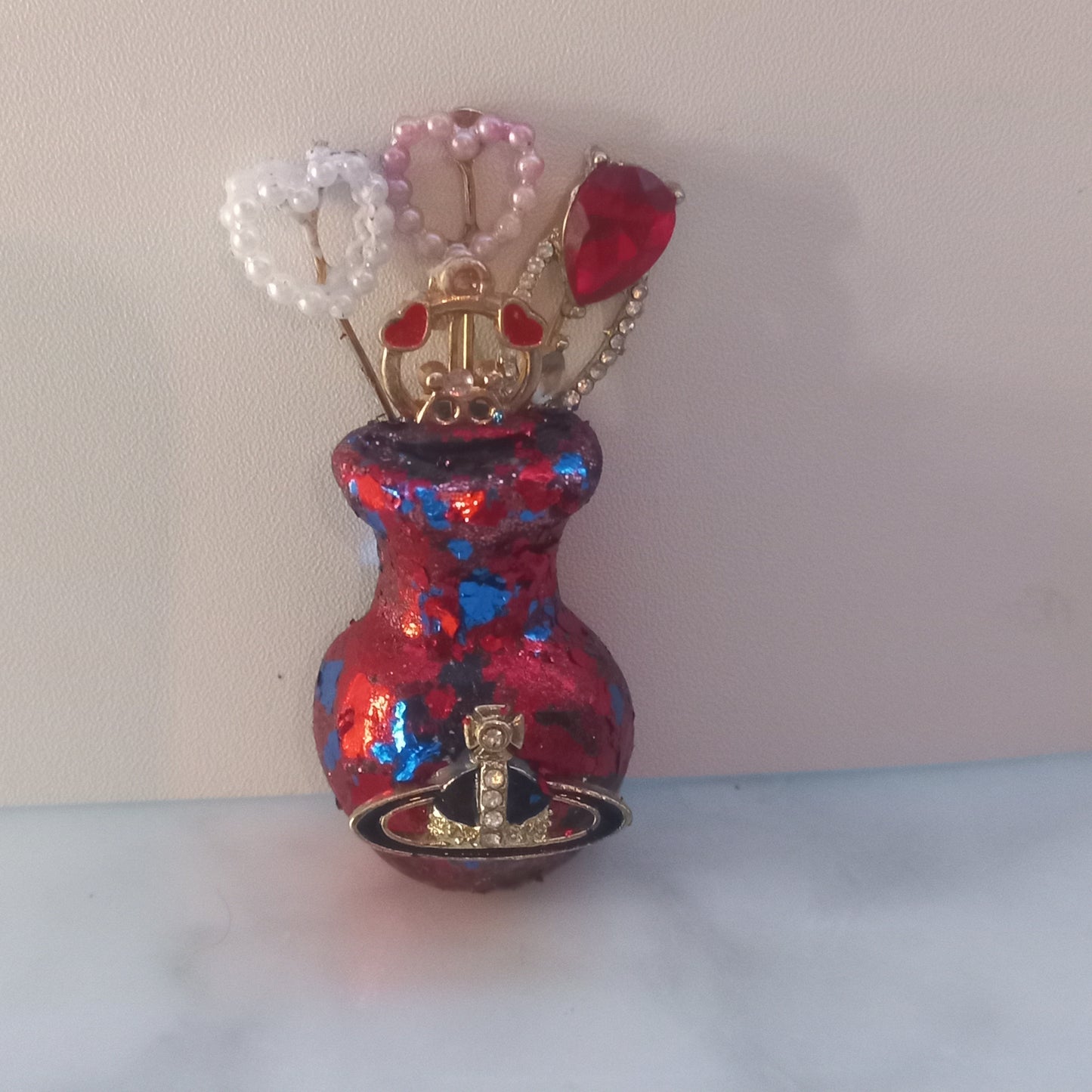 Red and blue foil vase brooch
