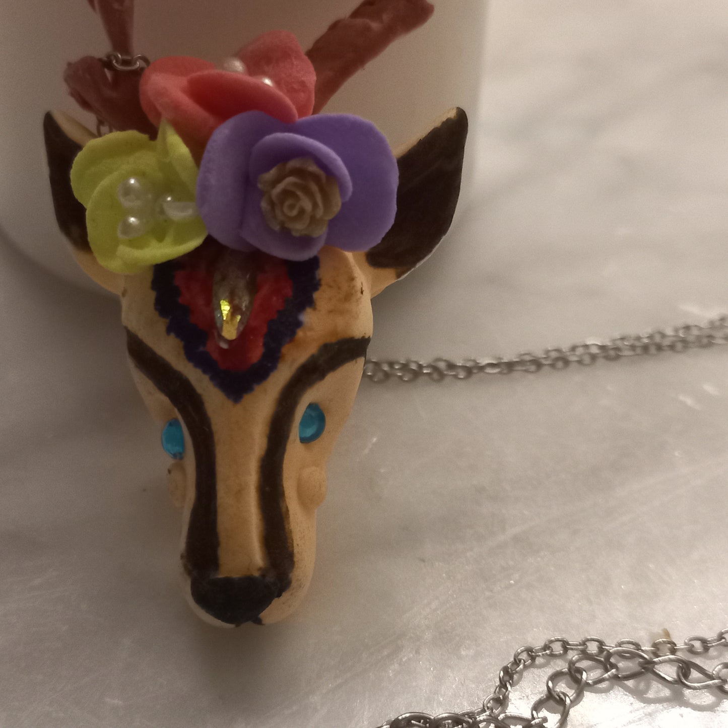 Polymer clay gazelle pendant