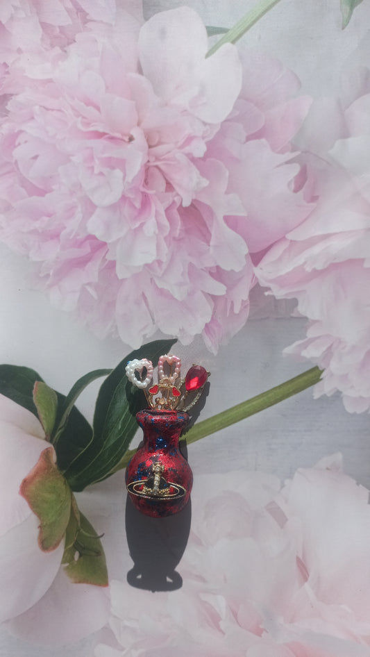 Red and blue foil vase brooch