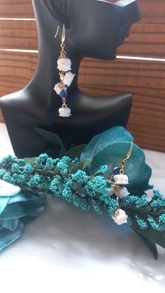 Polymer clay lily flowers with blue gemstones