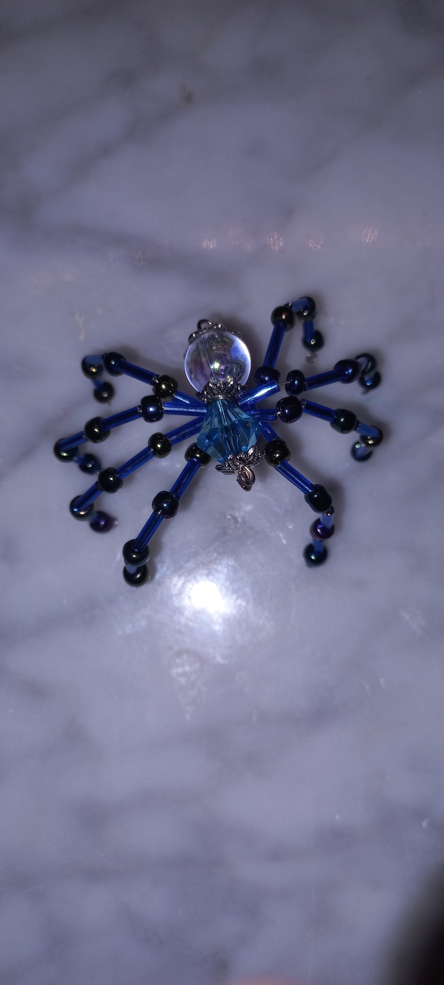 Beaded spider brooches