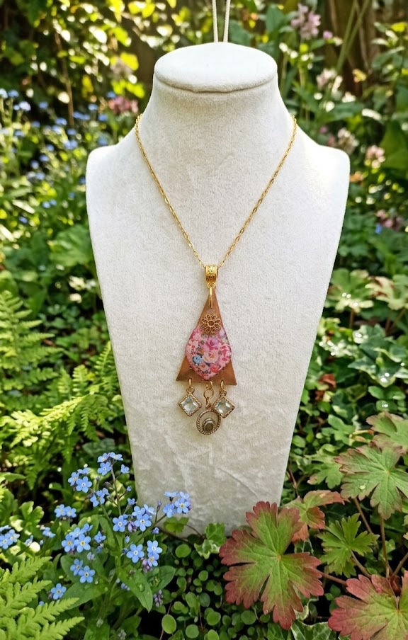 Polymer clay lace silkscreen floral pendant with gold plated chain.
